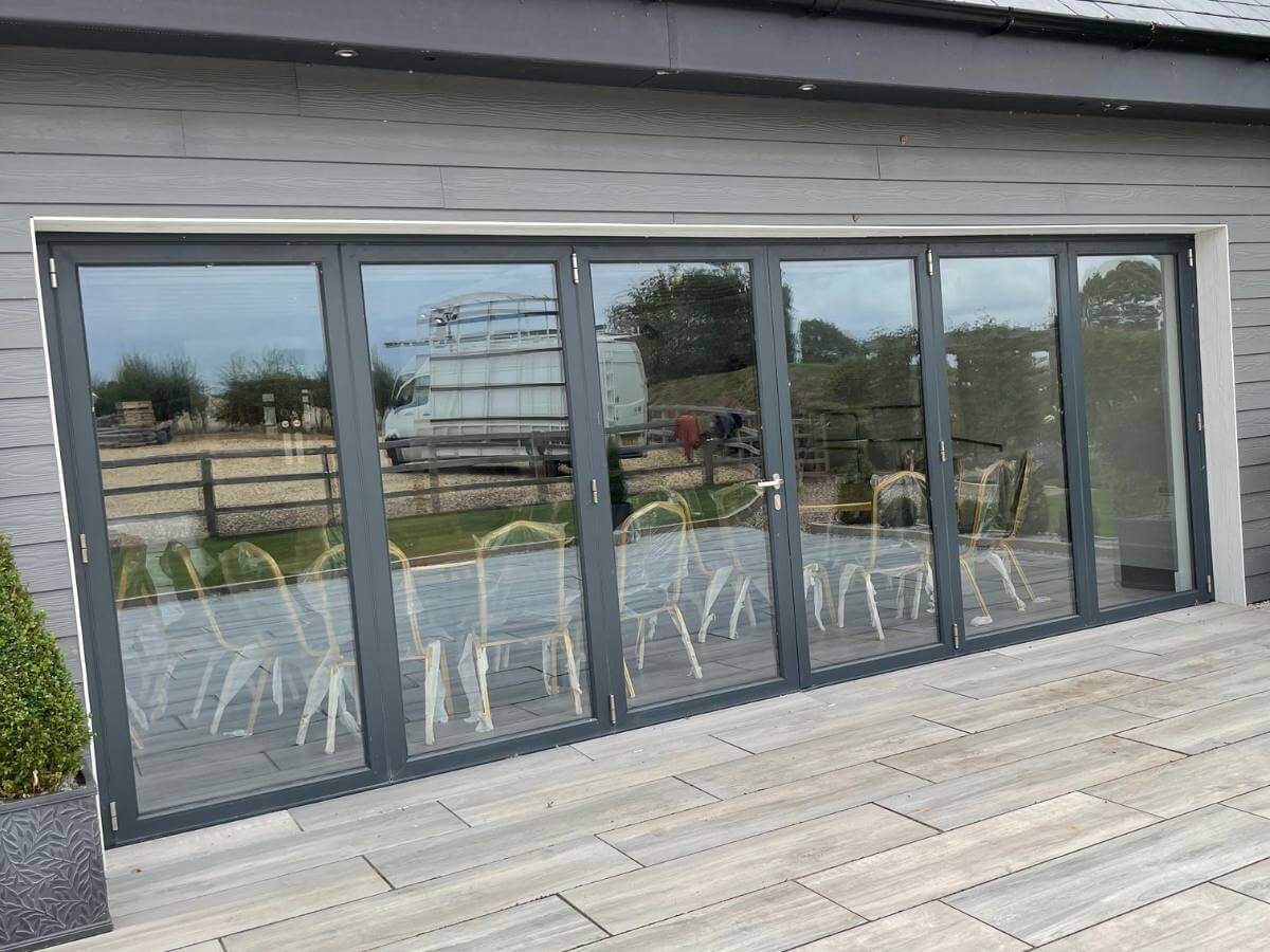 Anthracite grey aluminium bifold doors fitted to London patio area