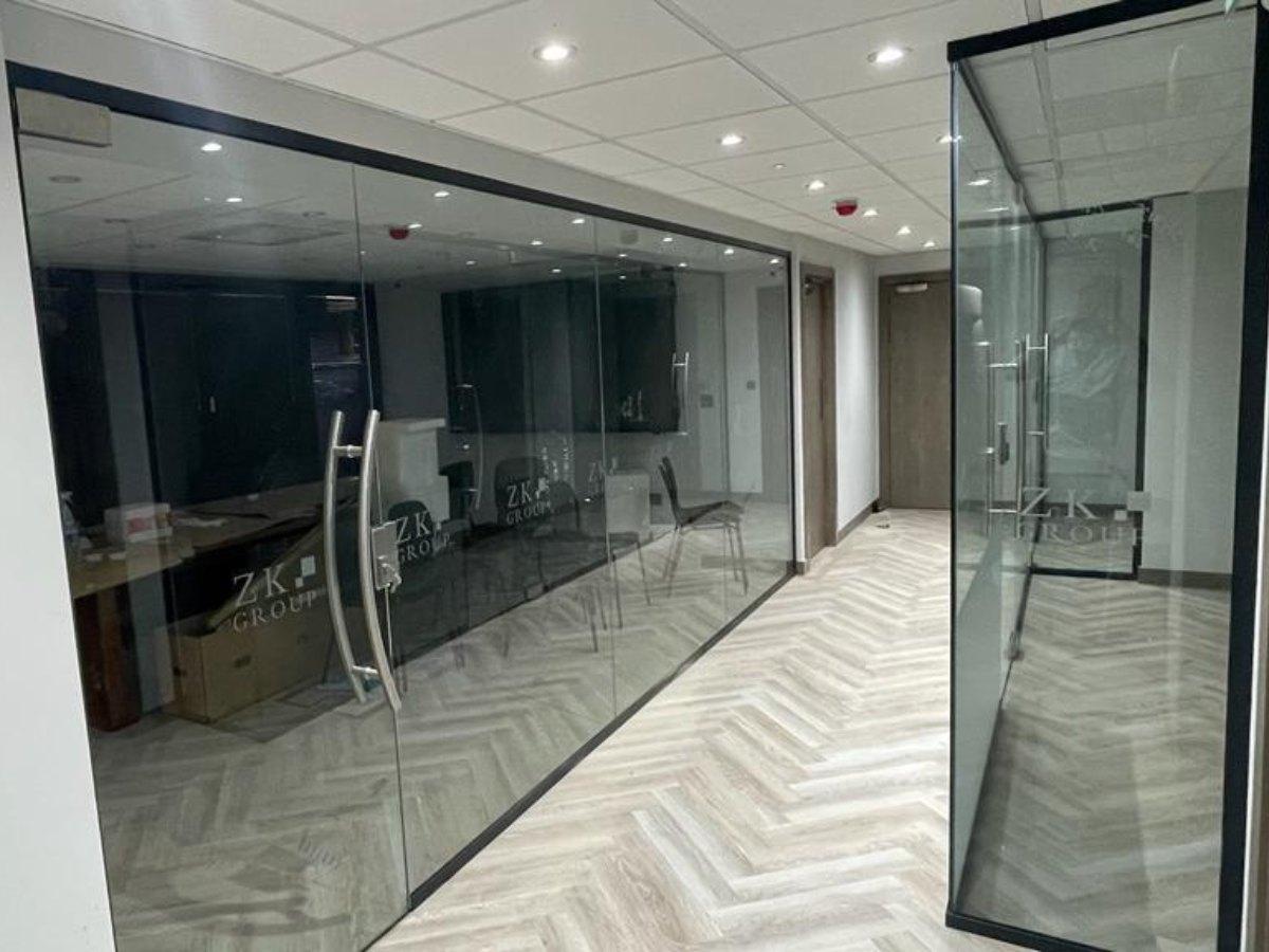 Made to measure glass partition meeting room with black frame and glass doors