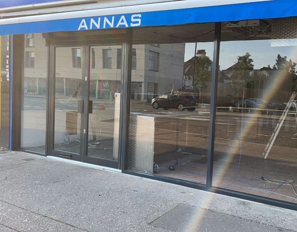 Bespoke aluminium shopfront with double doors and 8.8mm laminated glass installed by Redwood Shopfront in Westcliff-on-Sea