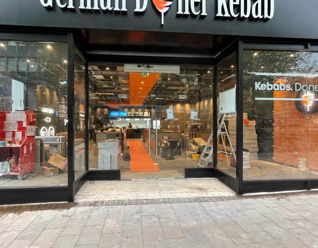 Frameless glass shopfront installation in Exeter by Redwood Shopfront