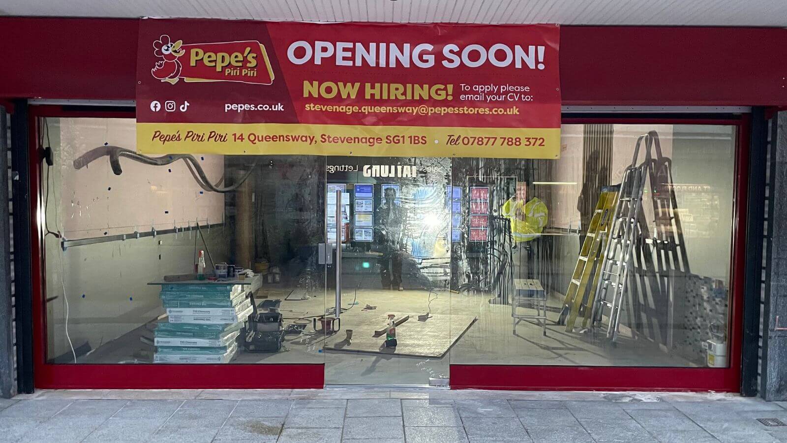 Full-height toughened glass shopfront with minimal framing in London