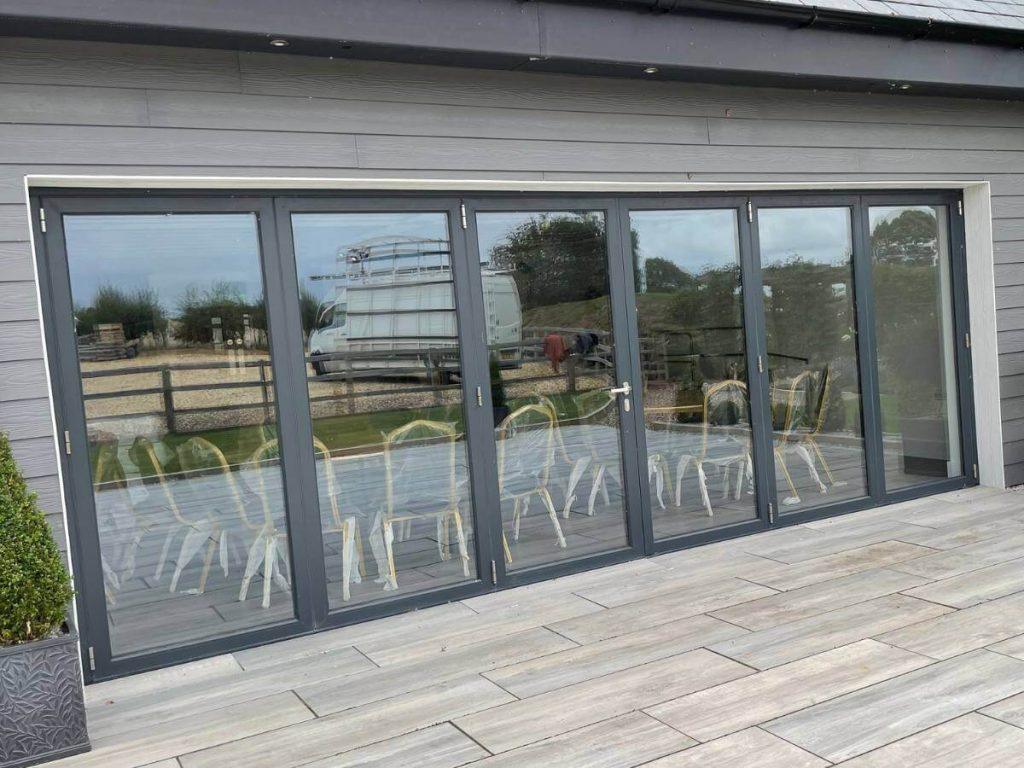Anthracite grey aluminium bifold doors fitted to London patio area
