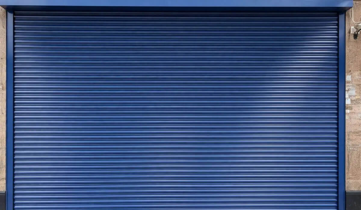 Security roller shutter installation by Redwood Shopfront at 20 Station Parade Ealing London