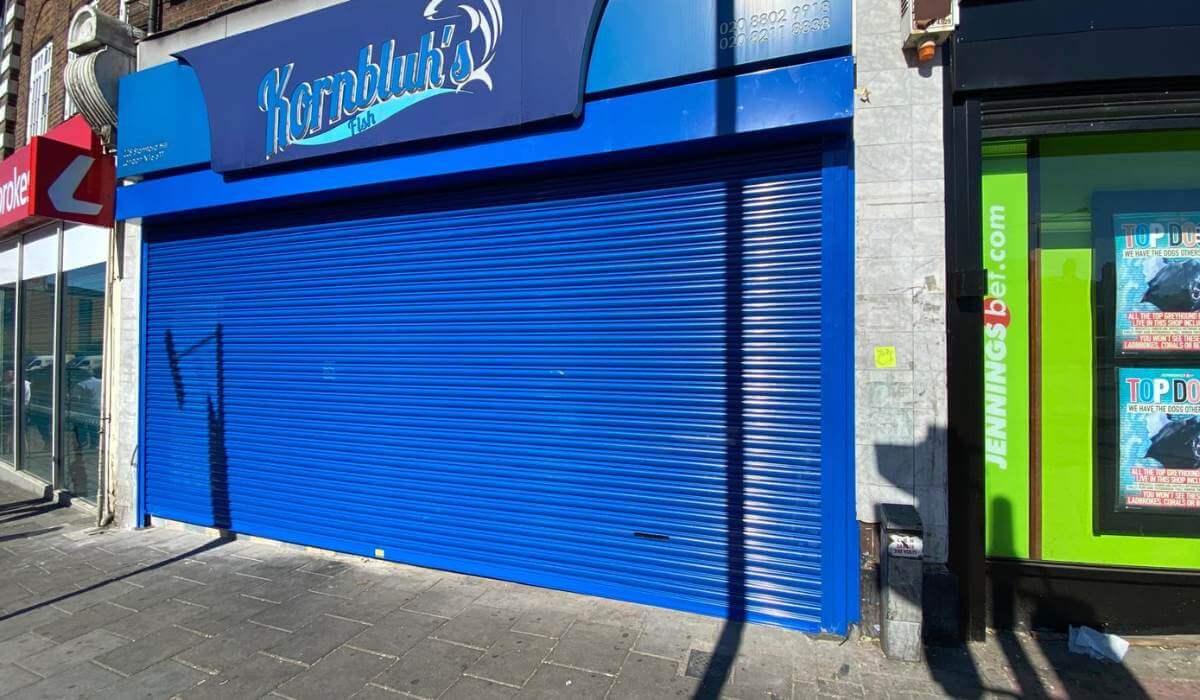 High-Security Blue Roller Shutter Installation at 228 Stamford Hill
