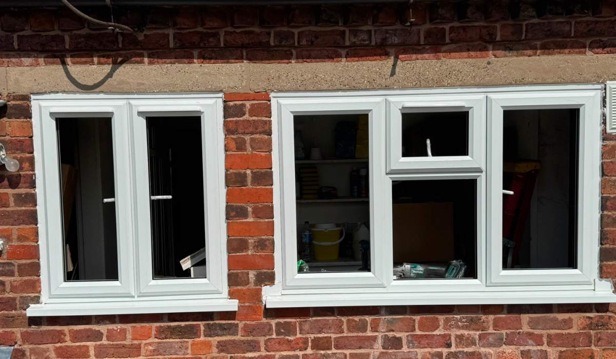 White uPVC casement windows installed in existing brickwork - Redwood Shopfront